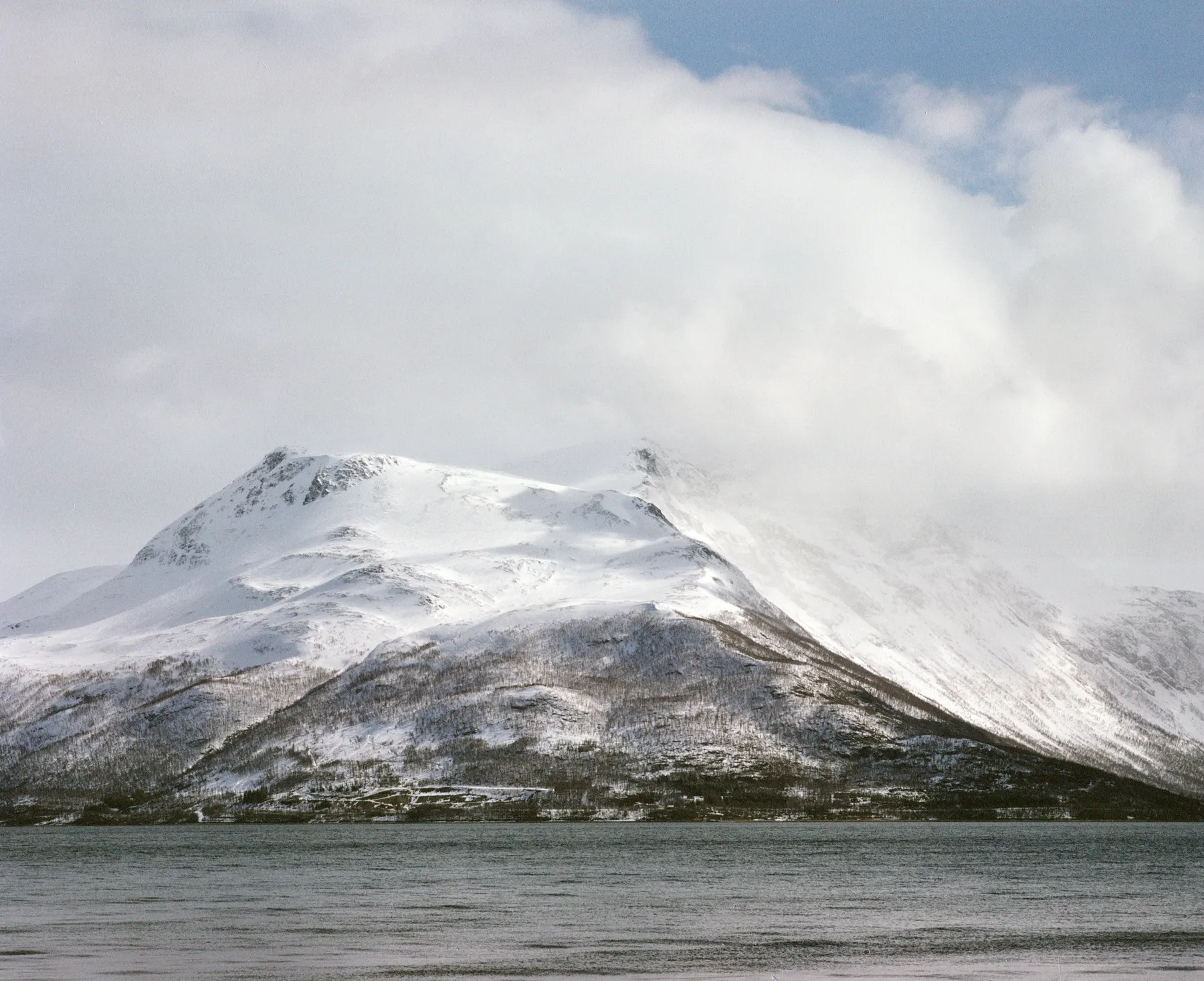 Snow peak over the water